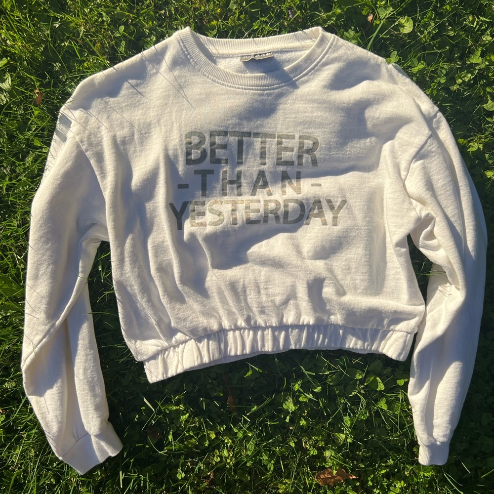 white cropped sweatshirt with "Better Than Yesterday" slogan size small